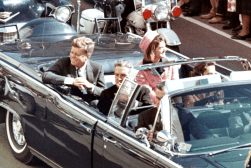 John f kennedy and john f kennedy in a convertible.